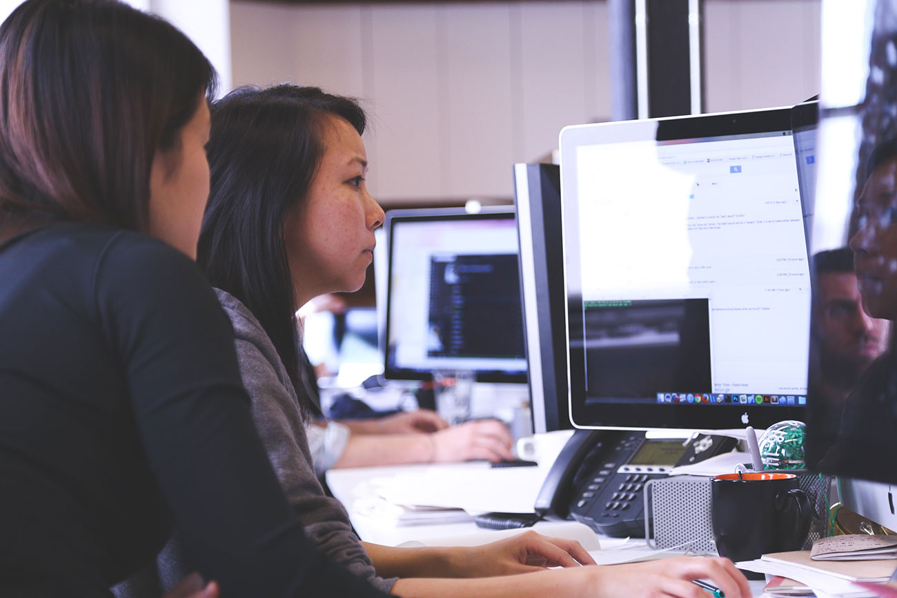 Women at desktop computer